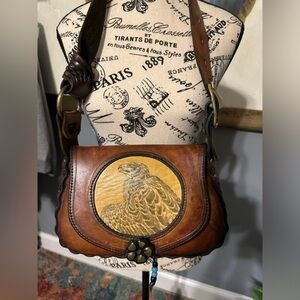 One of a kind hand tooled leather bag with eagle and brass hardware